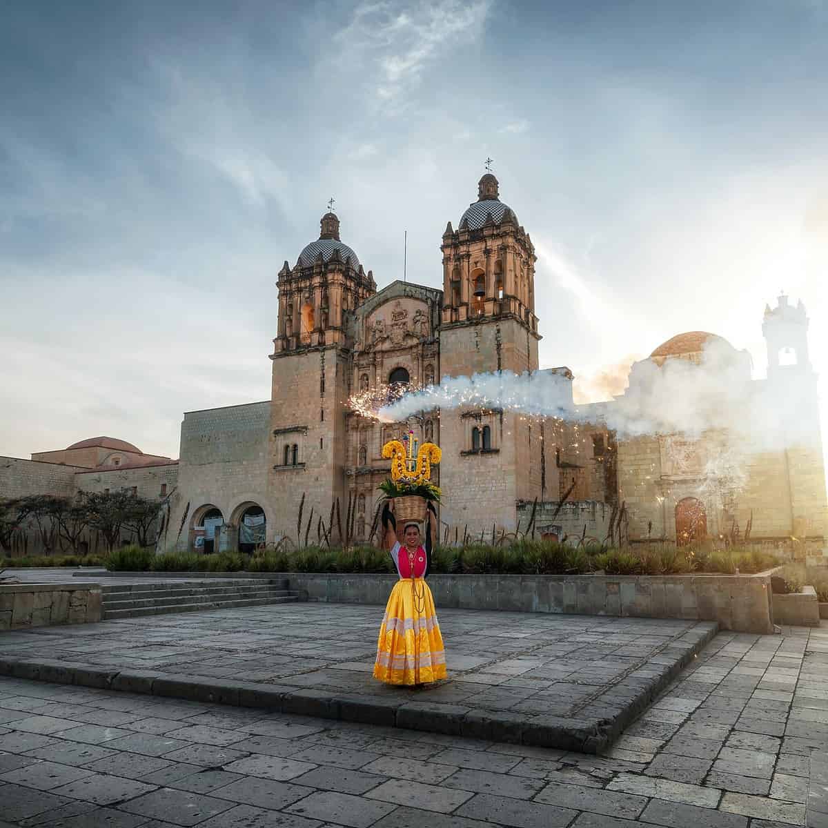 Vibrant, colorful street view of Guanajuato, Mexico with its steep, narrow roads and charming colonial-style houses painted in multiple hues.